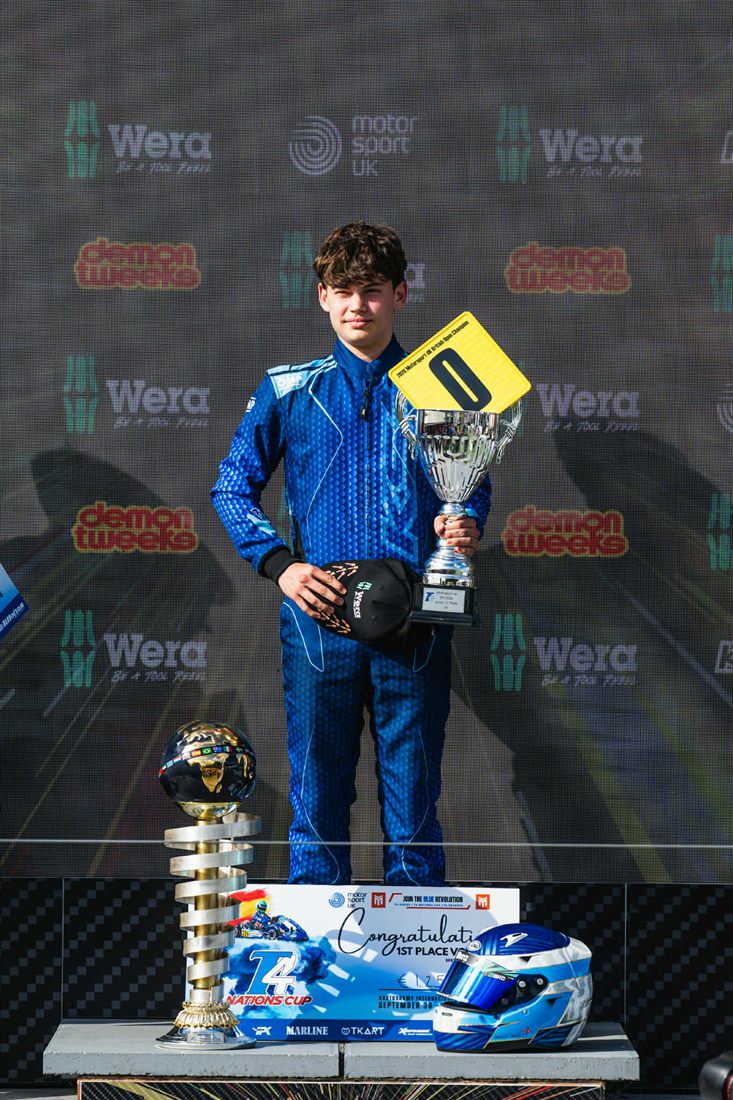 Angus Langley on the podium with his trophy